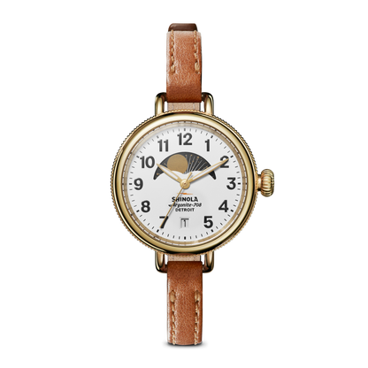 Shinola Birdy 34mm moon phase watch with white dial, gold PVD case and tan leather strap