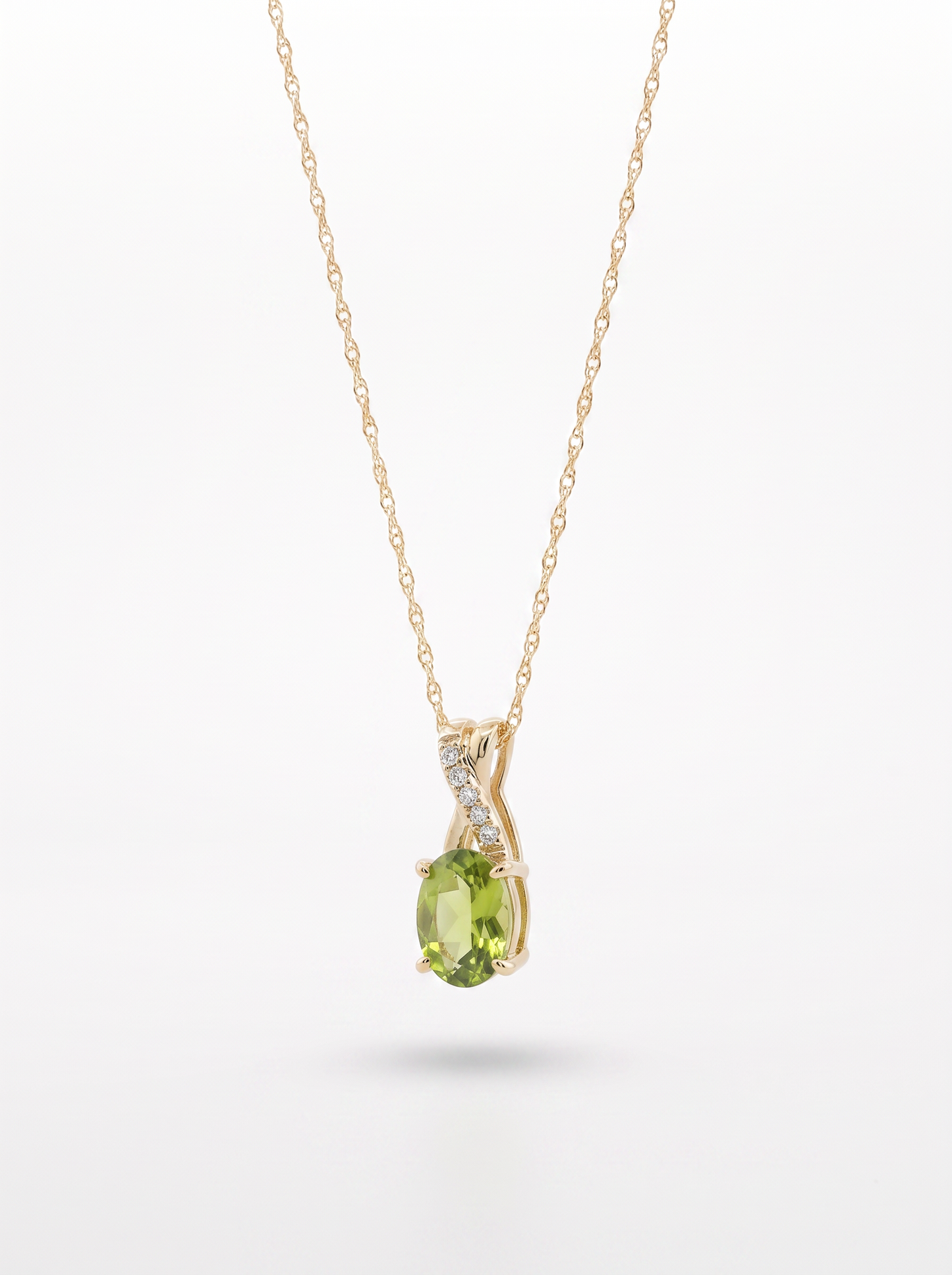 Peridot and diamond pendant necklace — angled view