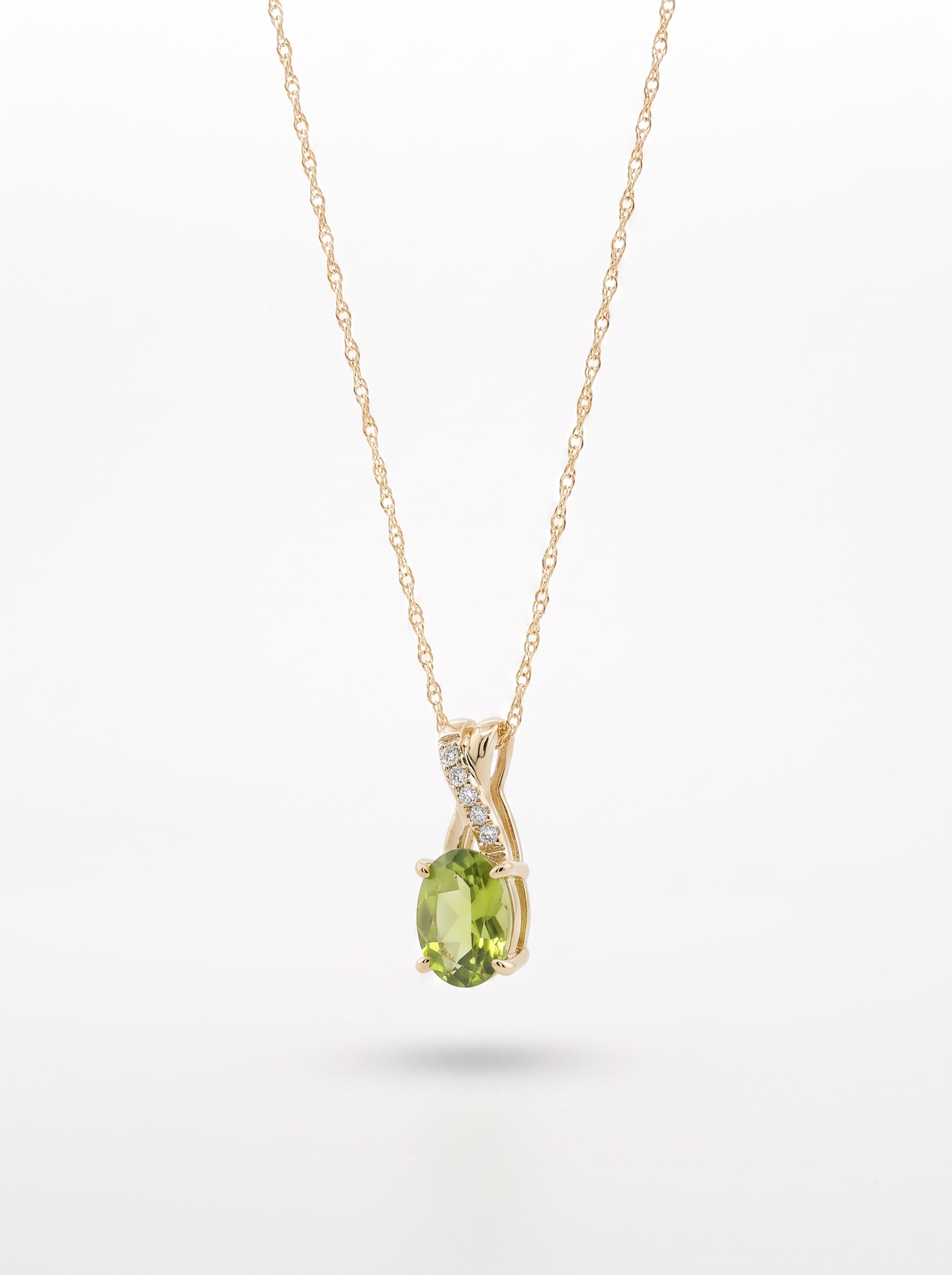 Peridot and diamond pendant necklace — angled view