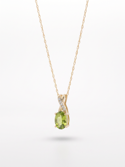 Peridot and diamond pendant necklace — angled view