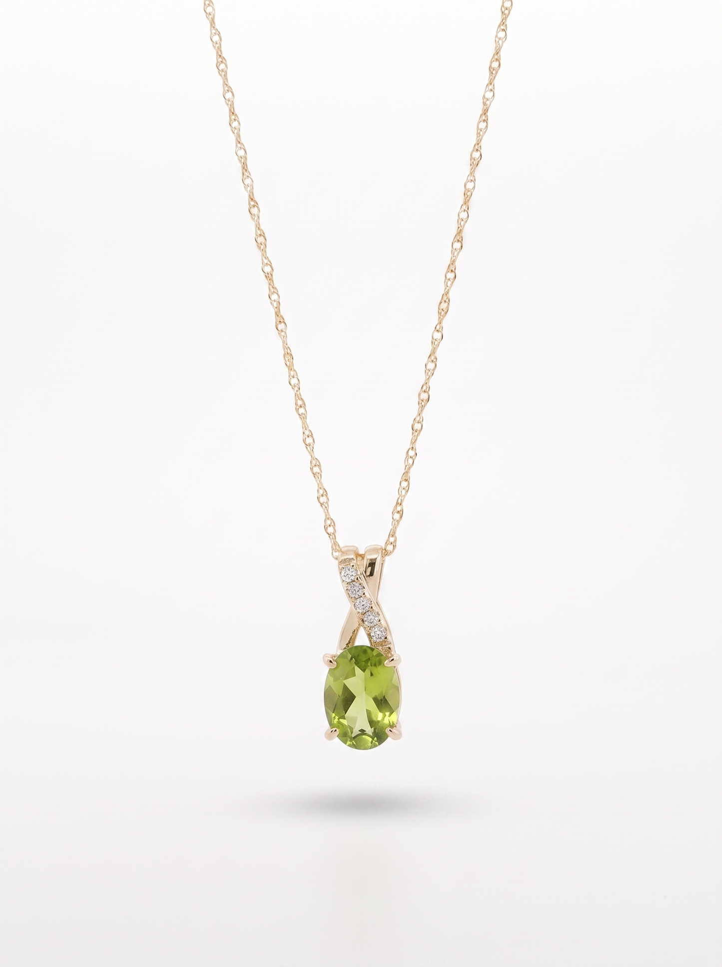 Peridot and diamond pendant necklace in 10K yellow gold — front view, white background