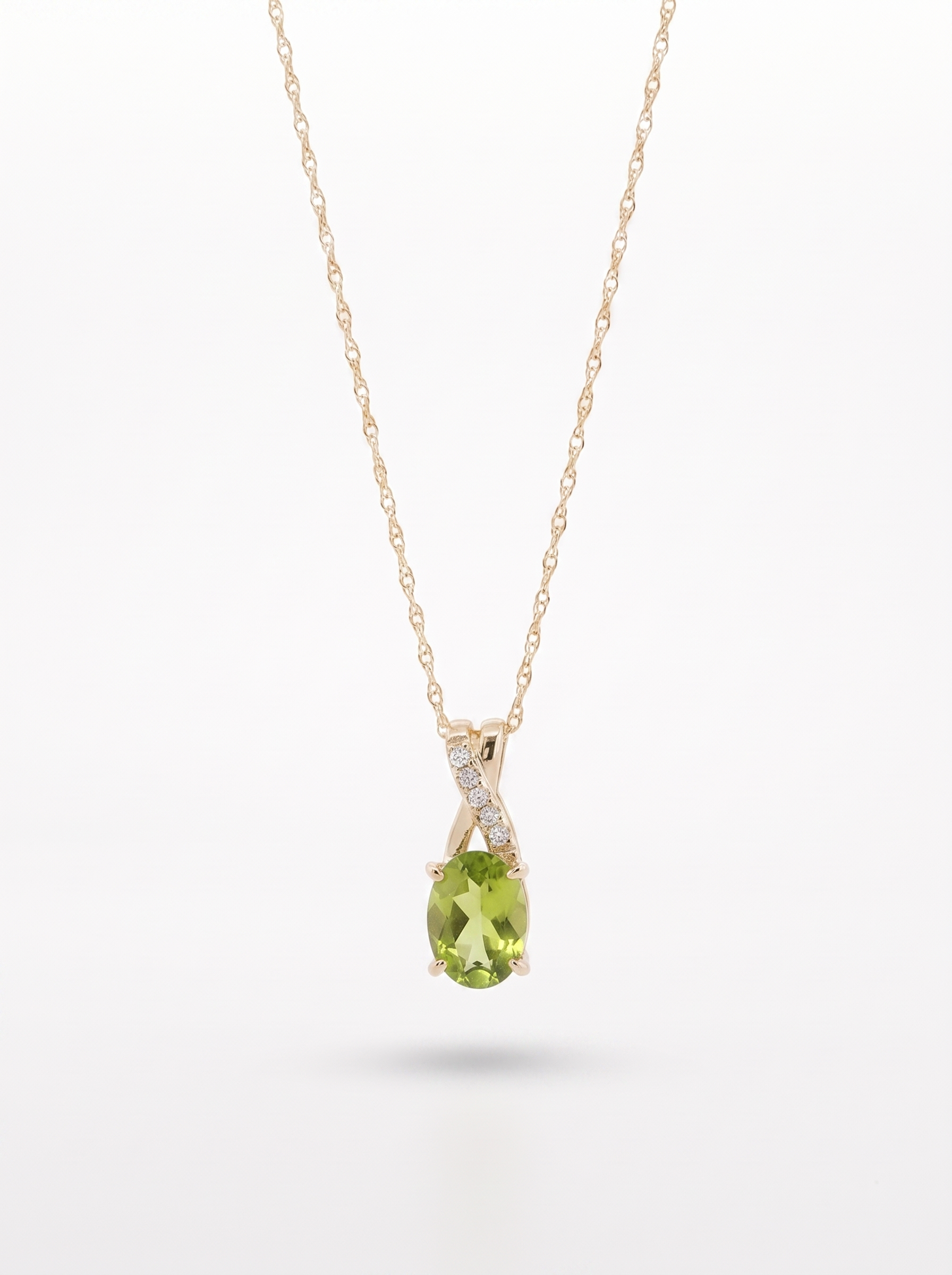 Peridot and diamond pendant necklace in 10K yellow gold — front view, white background