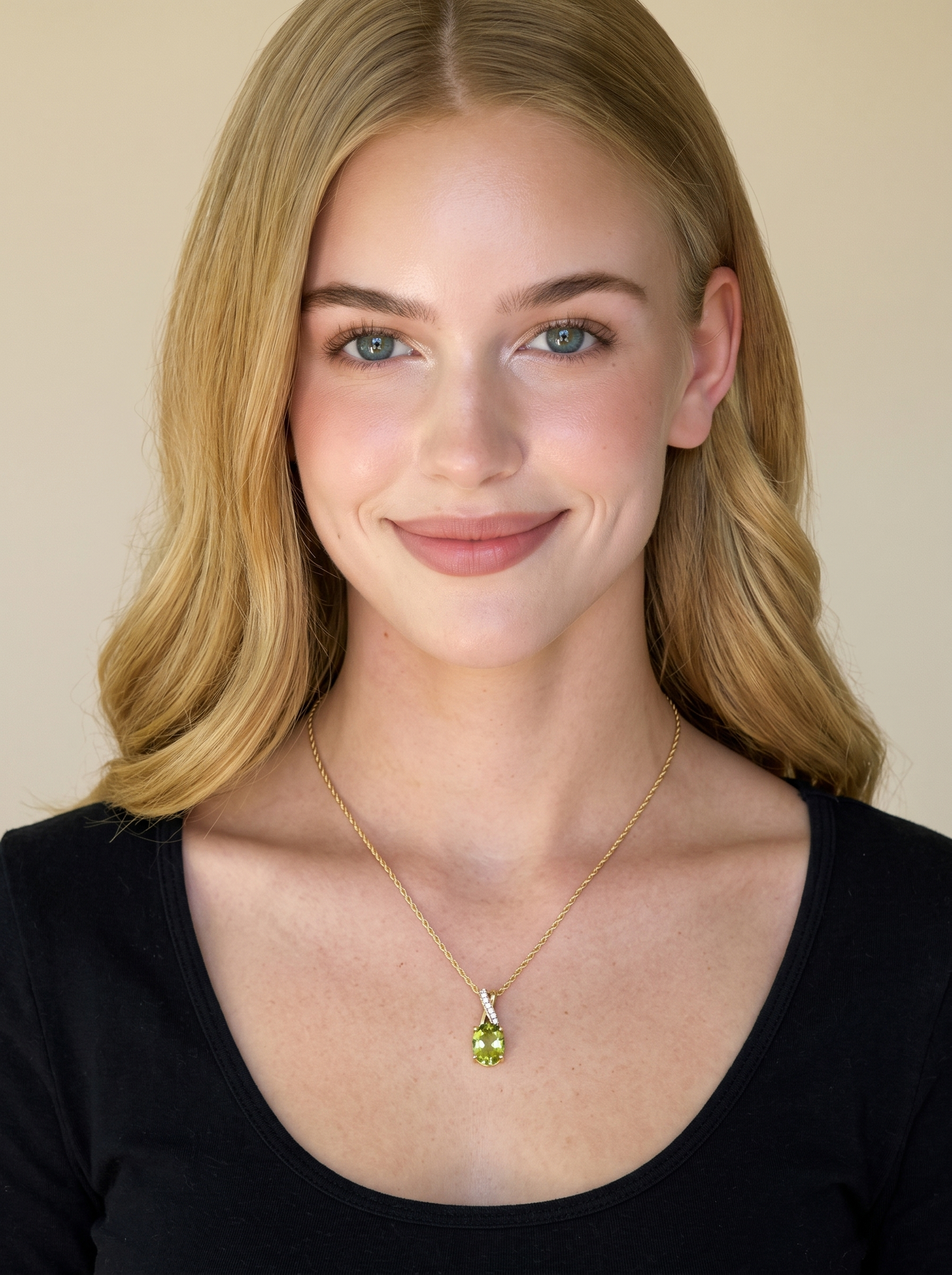 Peridot and diamond pendant necklace in 10K yellow gold worn on model